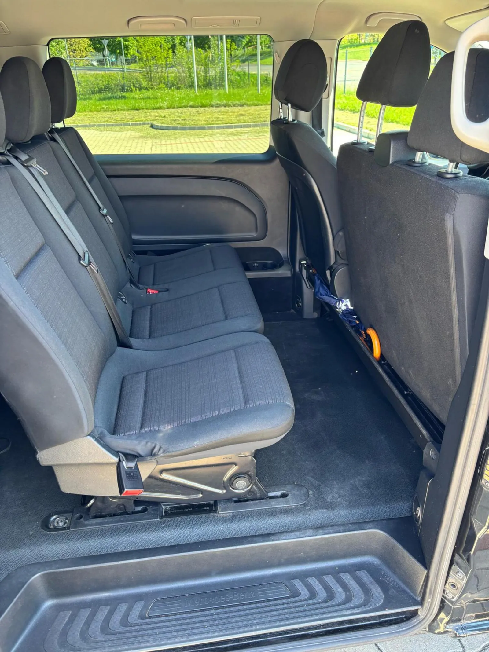 Grey passenger seats inside the private transfer minivan