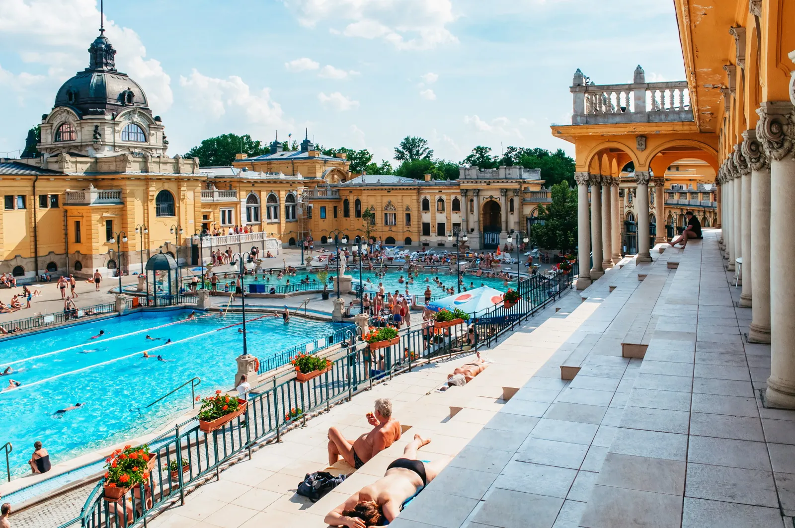 View from Széchenyi's colonnaded terrace over the outdoor swimming pool and domes